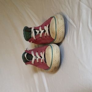 Pink, blue, and black low top Converse